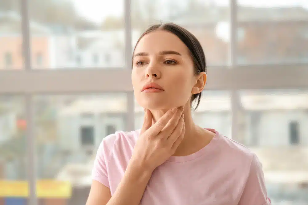 Woman feeling thyroid. Is it serious?